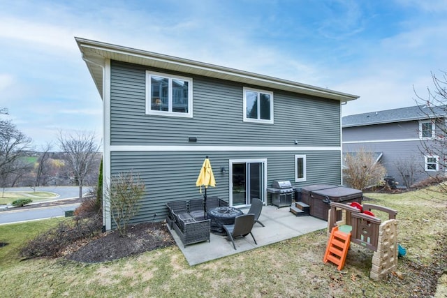 6679 S Chickahauk Trl, Middleton, WI 53562 - back of house featuring a patio, a hot tub, a lawn, and an outdoor fire pit