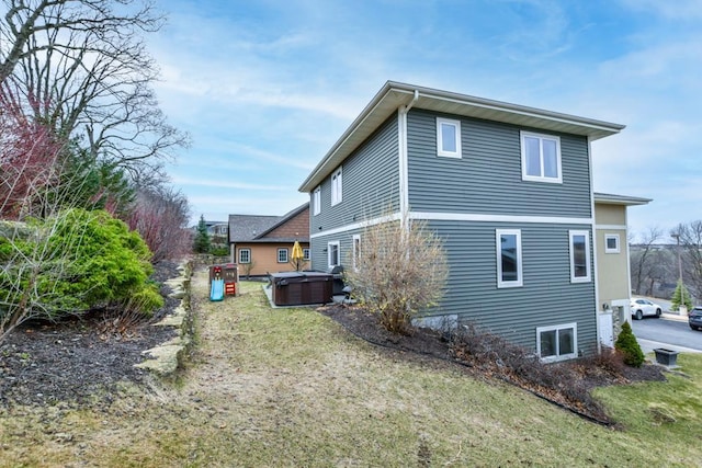 6679 S Chickahauk Trl, Middleton, WI 53562 - view of property exterior with a hot tub and a lawn
