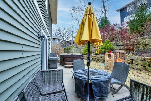 6679 S Chickahauk Trl, Middleton, WI 53562 - wooden deck featuring a hot tub, outdoor dining space, grilling area, and a patio
