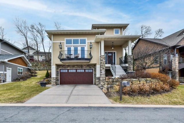 6679 S Chickahauk Trl, Middleton, WI 53562 - view of front of house featuring stucco siding, stone siding, a balcony, driveway, and a garage