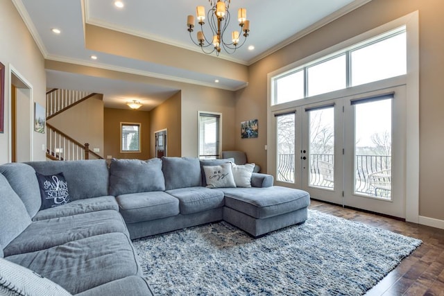 6679 S Chickahauk Trl, Middleton, WI 53562 - living room featuring ornamental molding, wood finished floors, recessed lighting, french doors, and a notable chandelier