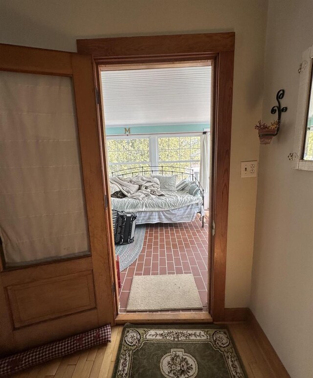 7533 N Evergreen Dr, Algoma, WI 54201 - entryway featuring wood finished floors, baseboards, and plenty of natural light