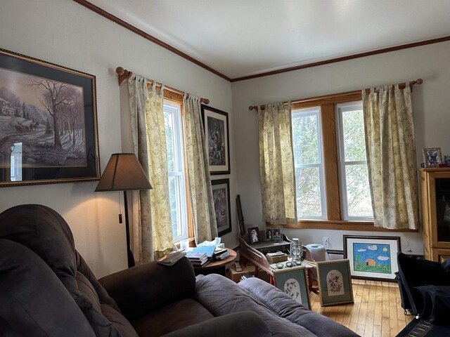 7533 N Evergreen Dr, Algoma, WI 54201 - living area with hardwood / wood-style floors, ornamental molding, and a healthy amount of sunlight
