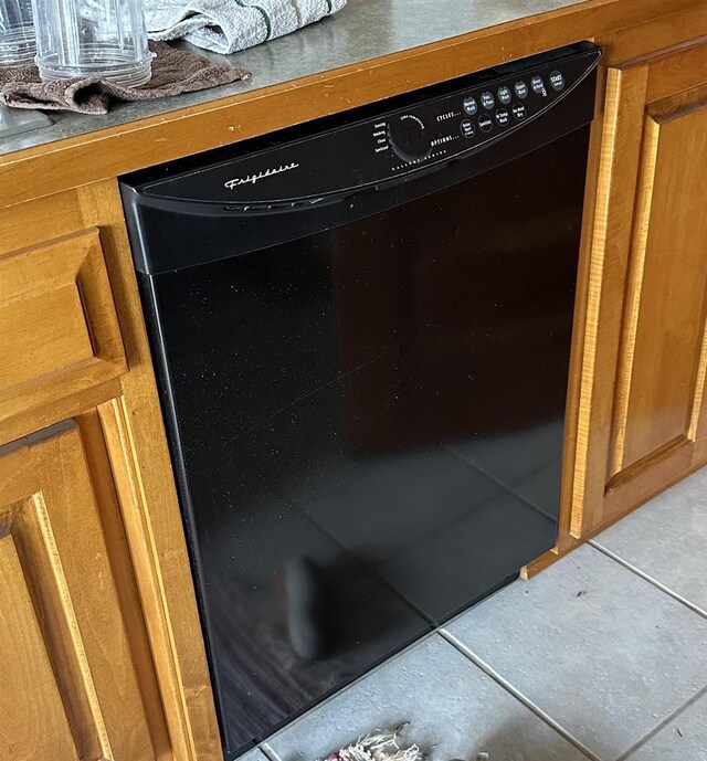 7533 N Evergreen Dr, Algoma, WI 54201 - details featuring dishwasher and brown cabinetry