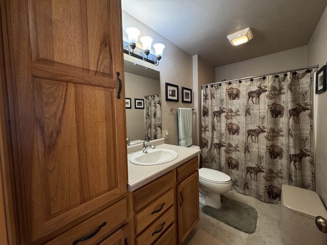 7118 Timber Ln, Rhinelander, WI 54501 - bathroom featuring tile patterned floors, vanity, toilet, and curtained shower