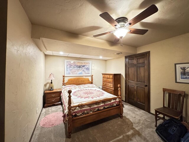 7118 Timber Ln, Rhinelander, WI 54501 - bedroom with carpet flooring, ceiling fan, and a textured wall