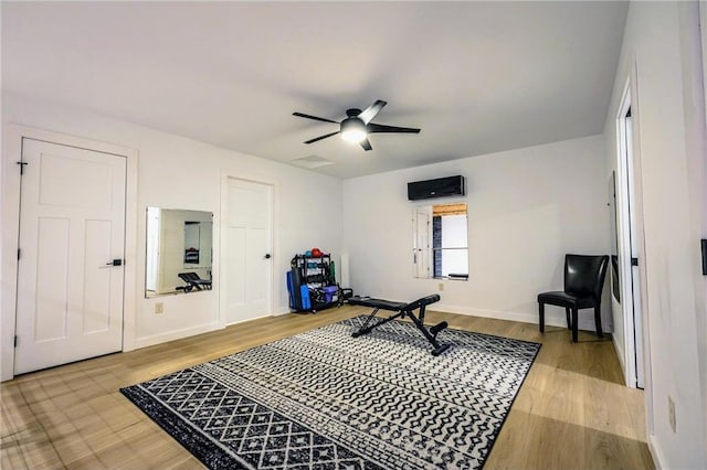 11684 Brook Ln, Hayward, WI 54843 - workout area featuring ceiling fan, baseboards, and wood finished floors