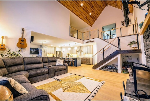 11684 Brook Ln, Hayward, WI 54843 - living room with stairway, ceiling fan, high vaulted ceiling, wood ceiling, and wood finished floors