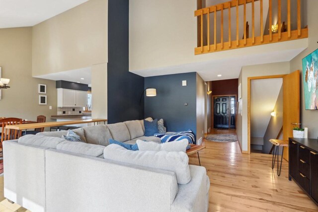 119 Vilas Hibbard Pkwy, Lodi, WI 53555 - living area with baseboards, a high ceiling, and light wood-style floors