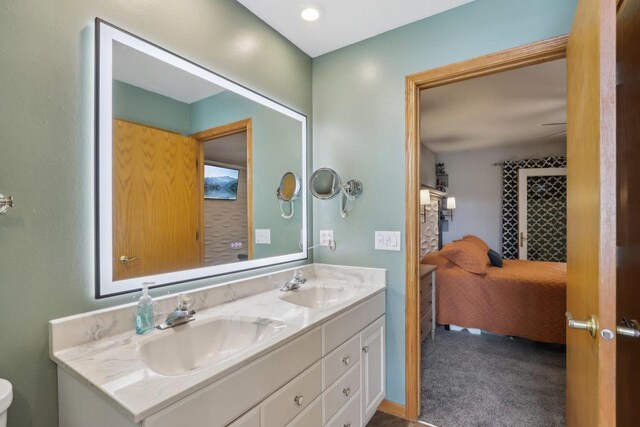 119 Vilas Hibbard Pkwy, Lodi, WI 53555 - ensuite bathroom with double vanity, a sink, toilet, and ensuite bathroom