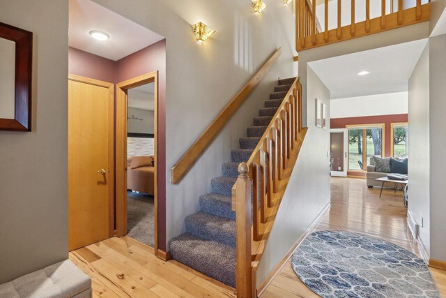 119 Vilas Hibbard Pkwy, Lodi, WI 53555 - stairs featuring baseboards and wood finished floors