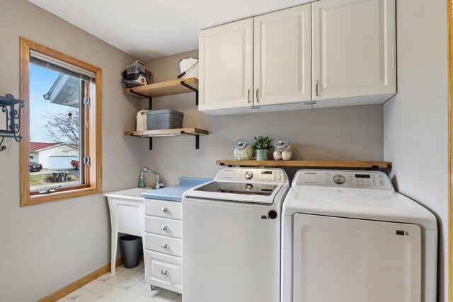 119 Vilas Hibbard Pkwy, Lodi, WI 53555 - laundry room with baseboards, cabinet space, and washer and clothes dryer