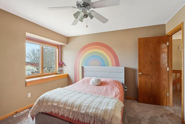 119 Vilas Hibbard Pkwy, Lodi, WI 53555 - bedroom with baseboards, visible vents, ceiling fan, and carpet floors