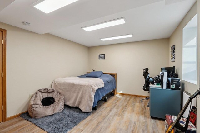 119 Vilas Hibbard Pkwy, Lodi, WI 53555 - bedroom featuring baseboards and wood finished floors