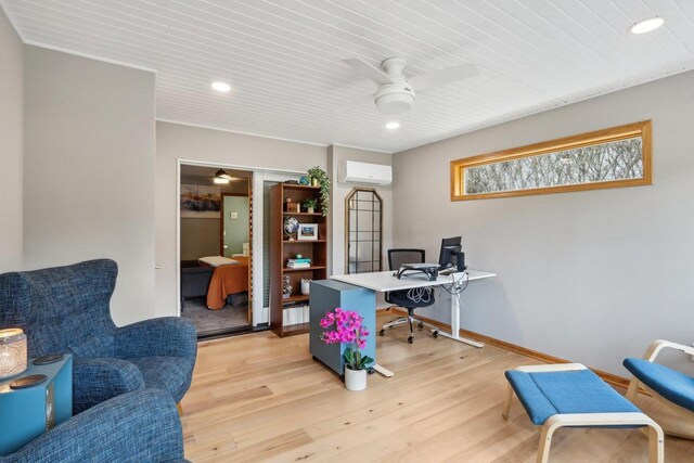 119 Vilas Hibbard Pkwy, Lodi, WI 53555 - home office featuring a ceiling fan, a wall unit AC, baseboards, and light wood-type flooring