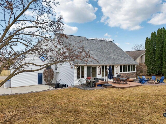 119 Vilas Hibbard Pkwy, Lodi, WI 53555 - back of house with a fire pit, roof with shingles, a patio area, and a lawn