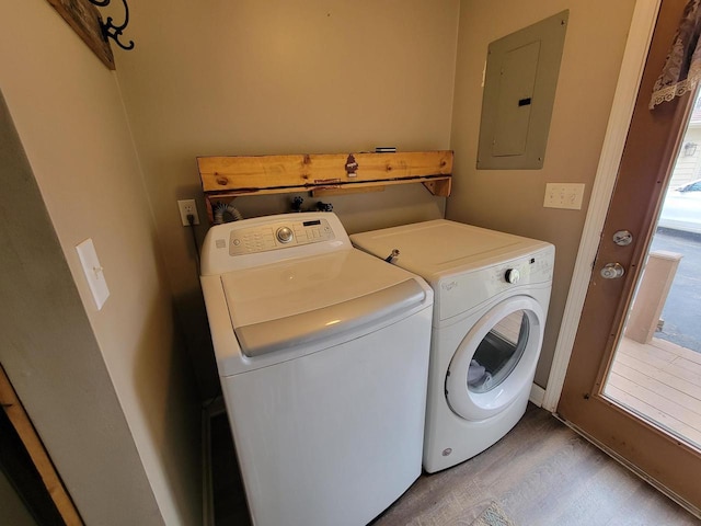 2215 N Shore Dr, Delavan, WI 53115 - washroom with electric panel, light wood-type flooring, washer and dryer, and laundry area