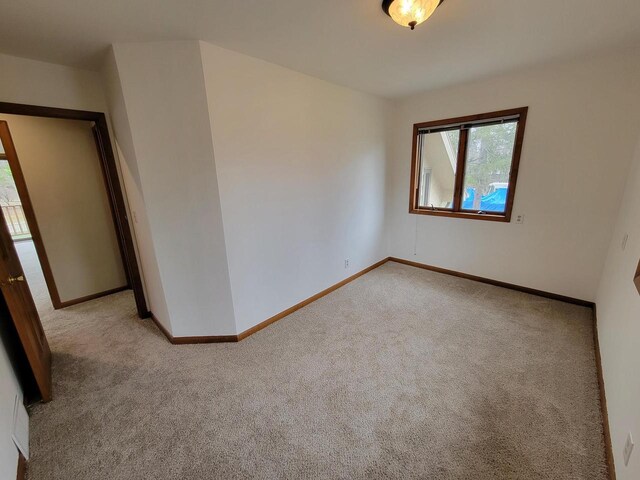 2215 N Shore Dr, Delavan, WI 53115 - empty room with carpet floors and baseboards
