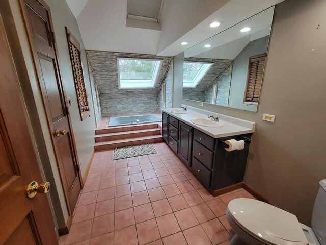 2215 N Shore Dr, Delavan, WI 53115 - bathroom featuring baseboards, toilet, tile patterned floors, vanity, and a garden tub