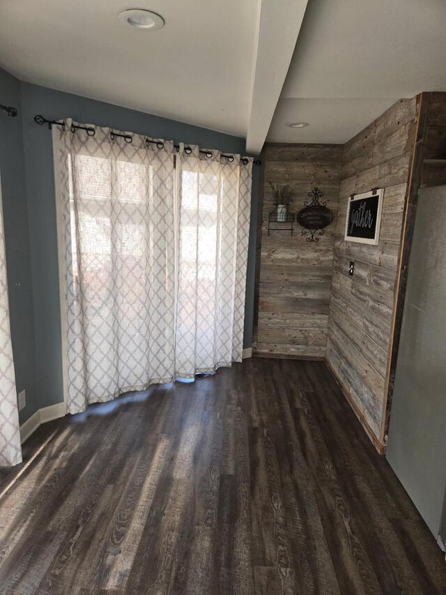 2215 N Shore Dr, Delavan, WI 53115 - unfurnished room with baseboards and dark wood-style flooring