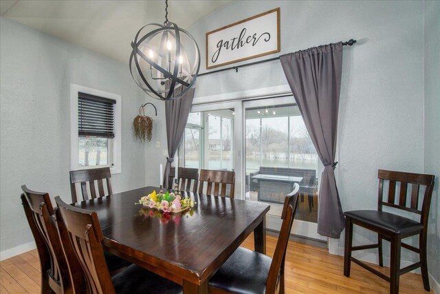 3265 Casey Trl, Oshkosh, WI 54904 - dining space with baseboards, an inviting chandelier, and light wood-type flooring