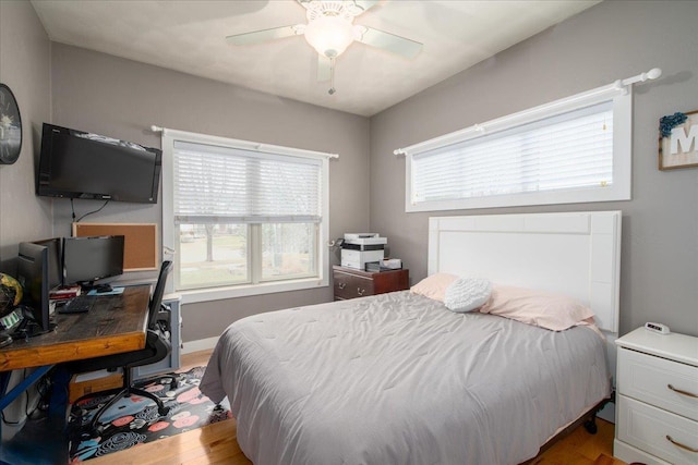 3265 Casey Trl, Oshkosh, WI 54904 - bedroom featuring baseboards, wood finished floors, and a ceiling fan