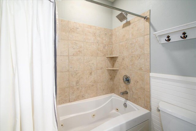 3265 Casey Trl, Oshkosh, WI 54904 - full bathroom with toilet, wainscoting, and a combined bath / shower with jetted tub