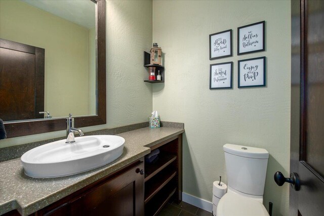 3265 Casey Trl, Oshkosh, WI 54904 - bathroom featuring baseboards, toilet, tile patterned flooring, and vanity
