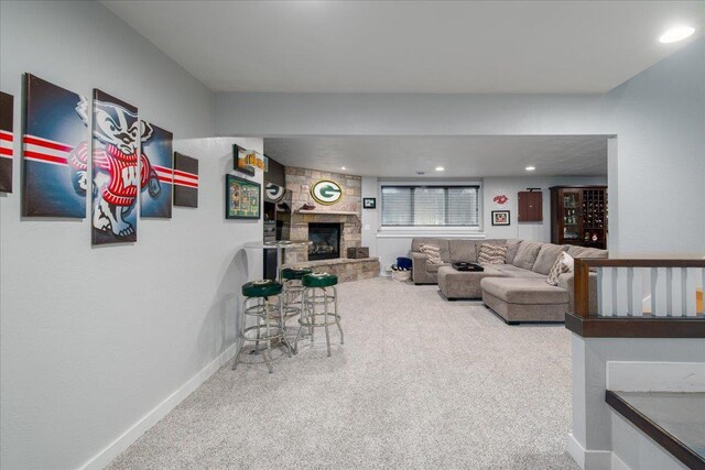3265 Casey Trl, Oshkosh, WI 54904 - living room with baseboards, carpet floors, and a stone fireplace