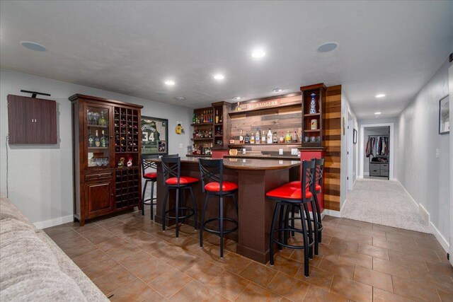 3265 Casey Trl, Oshkosh, WI 54904 - bar with a bar, baseboards, and recessed lighting