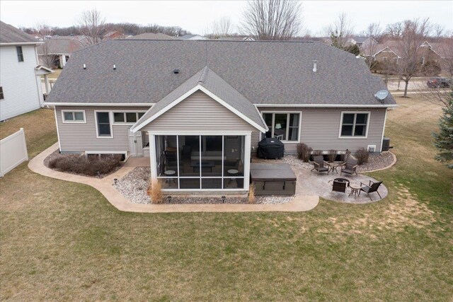 3265 Casey Trl, Oshkosh, WI 54904 - rear view of house with roof with shingles, fence, a fire pit, a yard, and a patio area