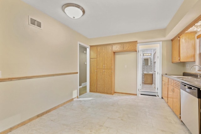 kitchen with baseboards, visible vents, stainless steel dishwasher, and a sink