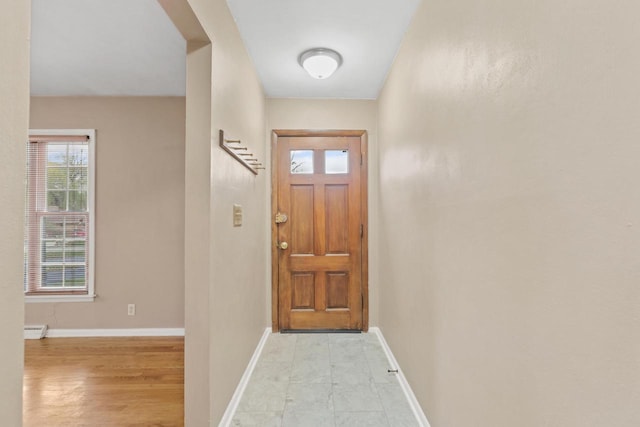 entryway featuring baseboards
