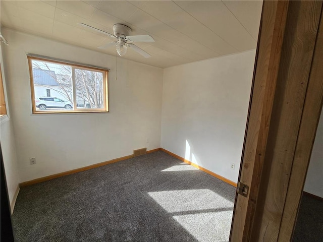unfurnished room featuring visible vents, baseboards, a ceiling fan, and carpet flooring