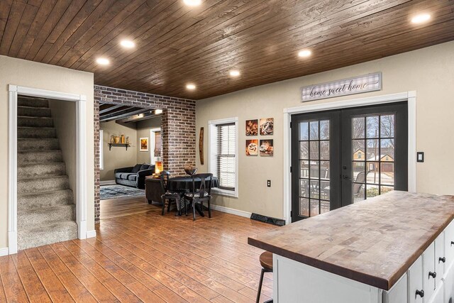 3304 Nicolet Dr, Green Bay, WI 54311 - interior space with french doors, light wood-style flooring, wooden ceiling, and stairway