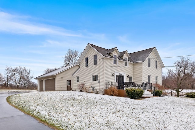 3304 Nicolet Dr, Green Bay, WI 54311 - view of side of home featuring driveway, a garage, and a deck