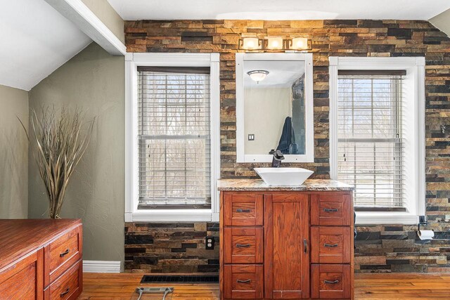 3304 Nicolet Dr, Green Bay, WI 54311 - bathroom with lofted ceiling, vanity, and hardwood / wood-style floors