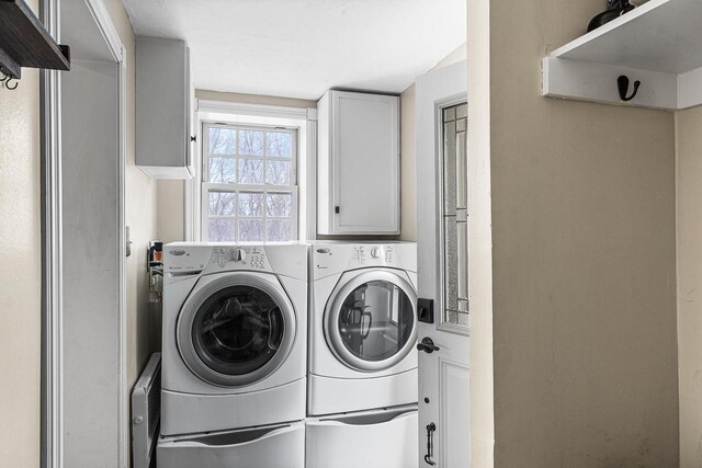 3304 Nicolet Dr, Green Bay, WI 54311 - clothes washing area featuring washing machine and clothes dryer and cabinet space