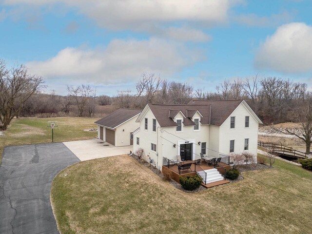 3304 Nicolet Dr, Green Bay, WI 54311 - view of home's exterior featuring a garage, fence, aphalt driveway, and a yard