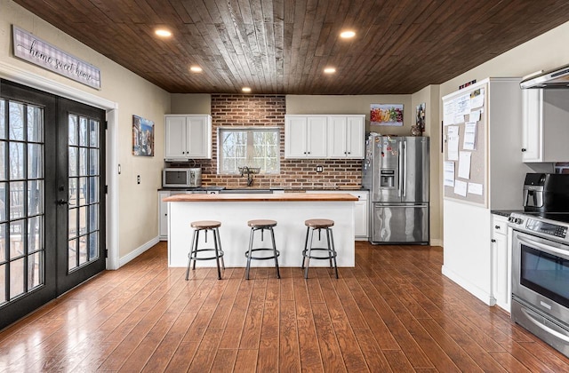 3304 Nicolet Dr, Green Bay, WI 54311 - kitchen with wooden counters, french doors, wooden ceiling, and appliances with stainless steel finishes