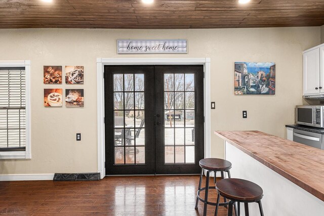 3304 Nicolet Dr, Green Bay, WI 54311 - entryway with baseboards, french doors, wood ceiling, and dark wood finished floors