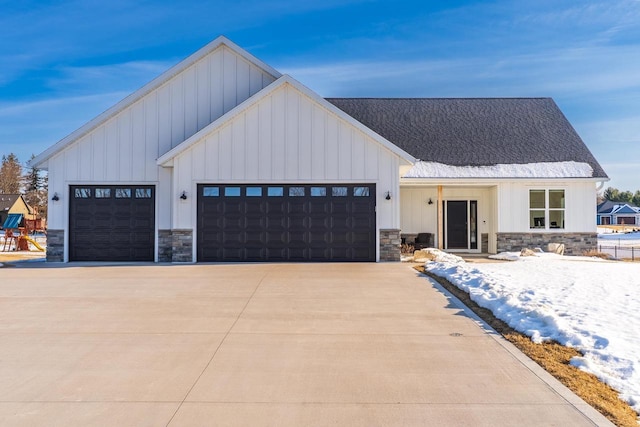 150551 Lavender Ln, Wausau, WI 54401 - modern farmhouse with stone siding, board and batten siding, concrete driveway, and a garage