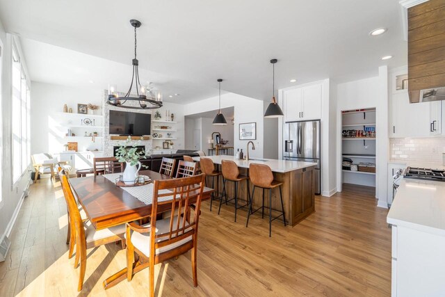 150551 Lavender Ln, Wausau, WI 54401 - dining space featuring recessed lighting, an inviting chandelier, and light wood-style floors