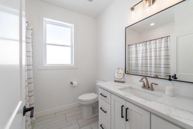 150551 Lavender Ln, Wausau, WI 54401 - bathroom with toilet, vanity, curtained shower, and baseboards