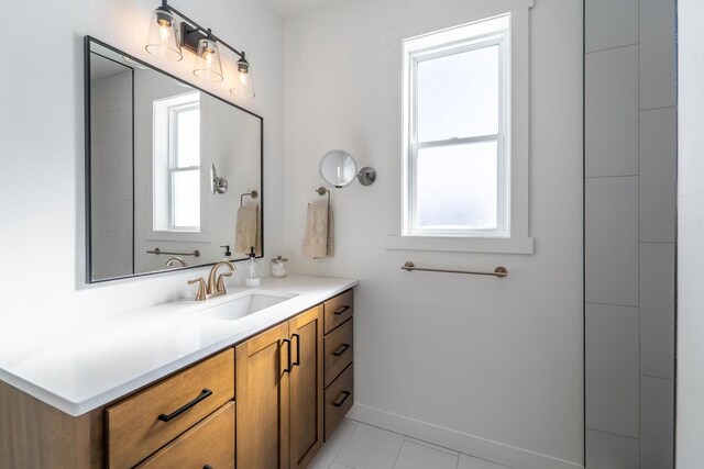 150551 Lavender Ln, Wausau, WI 54401 - bathroom with baseboards, tile patterned flooring, vanity, and plenty of natural light