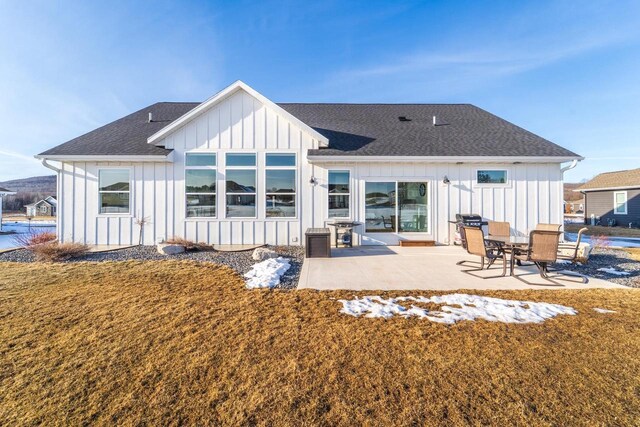 150551 Lavender Ln, Wausau, WI 54401 - back of property with a shingled roof, a patio area, and board and batten siding