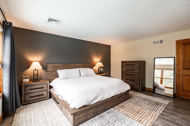 4824 Hampton Ct, Mount Pleasant, WI 53403 - bedroom with wood finished floors, visible vents, and baseboards