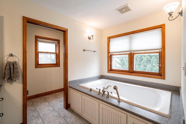 4824 Hampton Ct, Mount Pleasant, WI 53403 - full bathroom featuring a garden tub, tile patterned floors, visible vents, and plenty of natural light