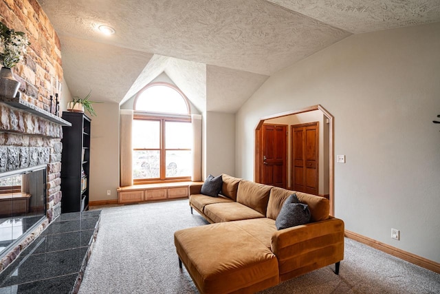 4824 Hampton Ct, Mount Pleasant, WI 53403 - carpeted living area with lofted ceiling, baseboards, and a stone fireplace