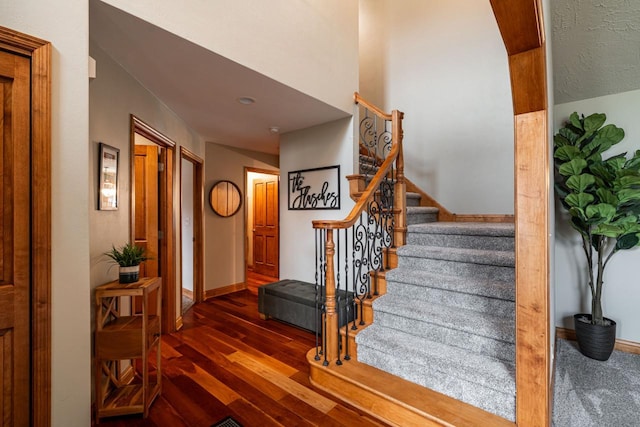 4824 Hampton Ct, Mount Pleasant, WI 53403 - staircase with wood-type flooring and baseboards
